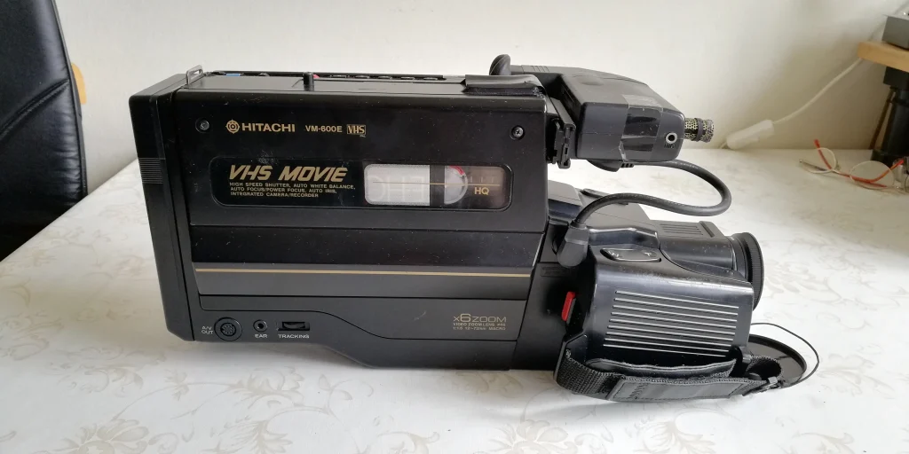 A Hitachi VM-600E VHS camcorder, classic 1990s home video camera