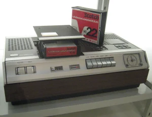 A classic Philips N1500 video cassette recorder (VCR), the world's first home VCR, shown on a white background